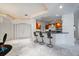 Entertaining space with counter seating and marble flooring perfect for guests at 1058 Roundstone Pl, Palm Harbor, FL 34683