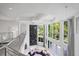 Airy living room with tall windows, a hanging light fixture and modern decor at 1058 Roundstone Pl, Palm Harbor, FL 34683