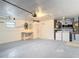 Shot of the garage featuring the laundry area, water heater, workspace, painted walls and floors at 12083 Rockford St, Spring Hill, FL 34608