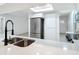 Bright kitchen boasts stainless steel appliances, modern fixtures, and stone countertops at 12083 Rockford St, Spring Hill, FL 34608