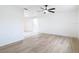 Spacious living room featuring wood floors and abundant natural light at 12083 Rockford St, Spring Hill, FL 34608
