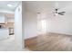 Bright and airy living room with modern wood flooring and ceiling fan at 12083 Rockford St, Spring Hill, FL 34608