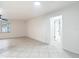 Inviting living room with neutral tones, tile flooring, and natural light at 12083 Rockford St, Spring Hill, FL 34608