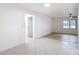 Open-concept living room features tile flooring and ample natural light at 12083 Rockford St, Spring Hill, FL 34608