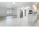 Expansive living space with an open floorplan connecting the living room and kitchen at 12083 Rockford St, Spring Hill, FL 34608