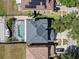 Aerial view of house showing pool, driveway, backyard and solar panels on roof at 12215 Adventure Dr, Riverview, FL 33579