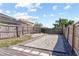This backyard boasts a bocce ball court and stone paver patio with seating at 12215 Adventure Dr, Riverview, FL 33579