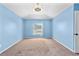 Bright bedroom featuring neutral carpet and a window with natural light at 12215 Adventure Dr, Riverview, FL 33579