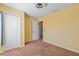 Bedroom includes carpeted floors, double closet doors, and an open doorway at 12215 Adventure Dr, Riverview, FL 33579