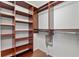 Walk-in closet with built-in shelving and hanging rods at 12215 Adventure Dr, Riverview, FL 33579