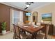Dining room featuring wood table with seating, recessed lighting, and neutral colors throughout the area at 12215 Adventure Dr, Riverview, FL 33579