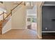 Open foyer with staircase and view to the outside patio area at 12215 Adventure Dr, Riverview, FL 33579
