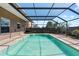 Enjoy the view from this beautiful screened-in pool, perfect for relaxing on a sunny day at 12215 Adventure Dr, Riverview, FL 33579