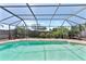 Enjoy the view from this beautiful screened-in pool, perfect for relaxing on a sunny day at 12215 Adventure Dr, Riverview, FL 33579