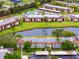 Scenic aerial view of the condo complex, featuring a tranquil pond and well-maintained landscaping at 129 Lakeview Way, Oldsmar, FL 34677