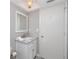 Bathroom with vanity, mirror, and modern fixtures and door at 129 Lakeview Way, Oldsmar, FL 34677