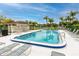 Community pool area offering a refreshing retreat for residents and guests to enjoy in a beautiful setting at 129 Lakeview Way, Oldsmar, FL 34677