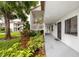 Walkway and landscaping leading to condo entrances at 129 Lakeview Way, Oldsmar, FL 34677