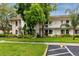 Well-maintained condo complex with lush landscaping and ample parking at 129 Lakeview Way, Oldsmar, FL 34677