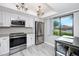 Charming eat-in kitchen featuring modern appliances and ample sunlight at 129 Lakeview Way, Oldsmar, FL 34677