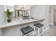 Stylish kitchen with granite countertops and barstool seating at 129 Lakeview Way, Oldsmar, FL 34677