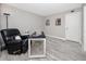 A home office featuring a black leather chair, a desk, and artwork on the walls at 129 Lakeview Way, Oldsmar, FL 34677
