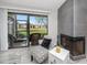 Relaxing screened-in porch with wicker furniture and scenic views of the lake at 129 Lakeview Way, Oldsmar, FL 34677