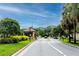 Community gatehouse entrance showing access point for residents on a bright, sunny day at 129 Lakeview Way, Oldsmar, FL 34677
