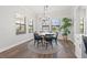 Dining room features a round table with seating for six and natural light from many windows at 13102 Foxtail Fern Dr, Riverview, FL 33579