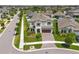Charming two-story home with a well-manicured lawn and beautiful landscaping at 13102 Foxtail Fern Dr, Riverview, FL 33579