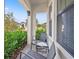 Charming front porch with space for seating and lovely landscaping at 13102 Foxtail Fern Dr, Riverview, FL 33579