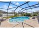 Backyard pool area featuring lounge seating and a screened enclosure for outdoor enjoyment at 13102 Foxtail Fern Dr, Riverview, FL 33579