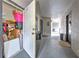 Hallway view featuring storage and entrance doors in a neutral color palette at 13210 Arbor Isle Dr # 207, Temple Terrace, FL 33637