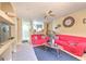 Open-concept living room flows into the kitchen, featuring neutral tones and ample seating at 13210 Arbor Isle Dr # 207, Temple Terrace, FL 33637