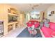 Cozy living area with built-in shelving, natural light, and comfortable furnishings at 13210 Arbor Isle Dr # 207, Temple Terrace, FL 33637