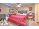Comfortable main bedroom with soft lighting, ceiling fan and dresser at 13210 Arbor Isle Dr # 207, Temple Terrace, FL 33637