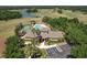 Aerial view of the community clubhouse, pool, and tennis courts at 1408 Brilliant Cut Way, Valrico, FL 33594