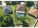 Aerial view showcases this beautiful home's backyard pool, lush landscaping, and privacy fence at 1408 Brilliant Cut Way, Valrico, FL 33594