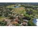 Aerial view of a home near a golf course and a lake in a serene community, edged in red for emphasis at 1408 Brilliant Cut Way, Valrico, FL 33594
