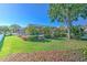 Lush backyard features a screened-in pool, mature landscaping, and ample green space for outdoor enjoyment at 1408 Brilliant Cut Way, Valrico, FL 33594