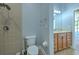 A bathroom featuring tile shower and vanity with sink at 1408 Brilliant Cut Way, Valrico, FL 33594