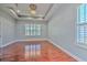 Bedroom with hardwood floors and large window at 1408 Brilliant Cut Way, Valrico, FL 33594