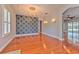 Dining room boasting hardwood floors, statement wall, chandelier, and recessed lights at 1408 Brilliant Cut Way, Valrico, FL 33594