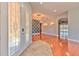 Elegant foyer featuring a decorative chandelier, hardwood floors, arched doorways, and a sophisticated design at 1408 Brilliant Cut Way, Valrico, FL 33594