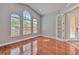 Bright office with hardwood floors, vaulted ceilings, and large windows offering plenty of natural light at 1408 Brilliant Cut Way, Valrico, FL 33594