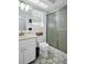 Clean bathroom features a shower, toilet, vanity, and window with natural light at 1657 Glengarry Dr, Palm Harbor, FL 34684