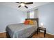 Serene bedroom with hardwood floors, a ceiling fan, and comfortable queen size bed at 1657 Glengarry Dr, Palm Harbor, FL 34684