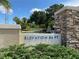 Community entrance sign with stone accents, landscaping, and 'Elevation 86 FT' inscription at 1657 Glengarry Dr, Palm Harbor, FL 34684