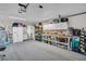 Spacious garage with ample storage, a utility sink, and access to the house at 1657 Glengarry Dr, Palm Harbor, FL 34684