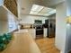 Bright kitchen showcasing white cabinets, stainless steel appliances, and butcher block countertops at 1657 Glengarry Dr, Palm Harbor, FL 34684